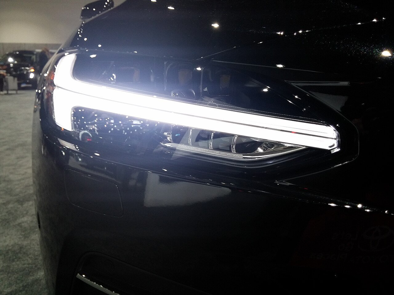 Real photograph of a modern vehicle LED daytime running light and headlamp