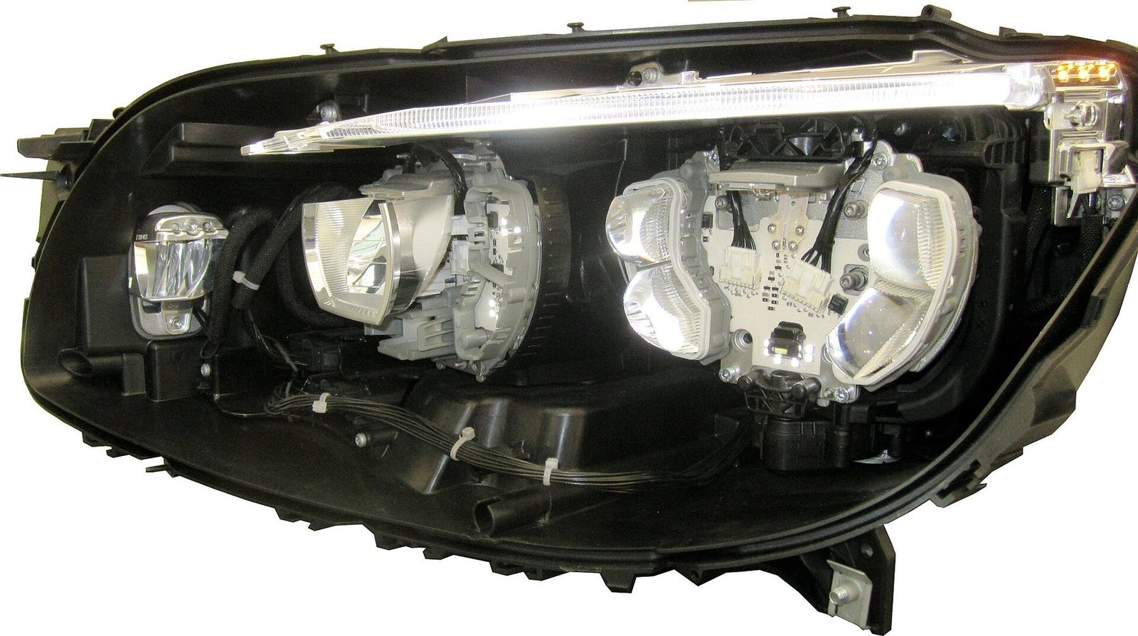 Real photograph showing internal components of an LED automotive headlamp
