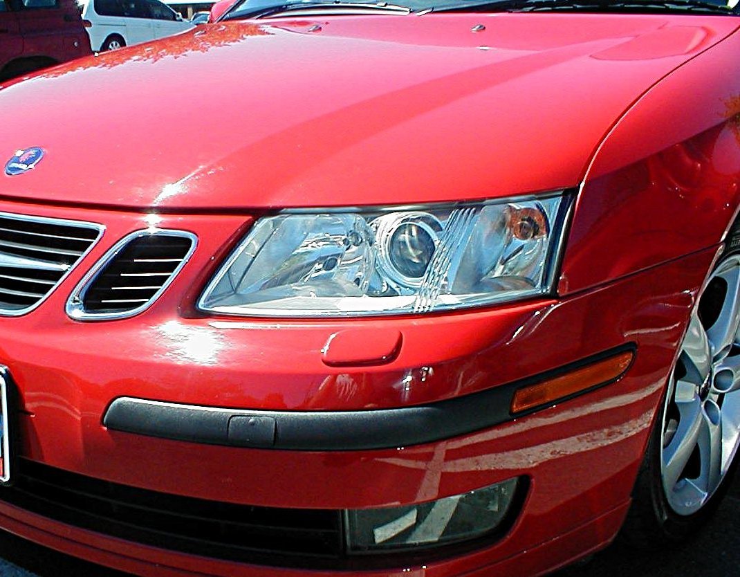 Real automotive headlight photograph comparing projector and reflector optics