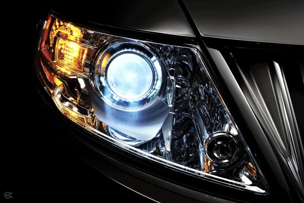 Close real-world photograph of an automotive xenon headlamp assembly