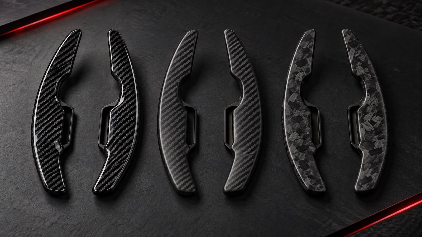 Gloss woven, satin woven, and forged carbon fiber paddle-shifter finishes