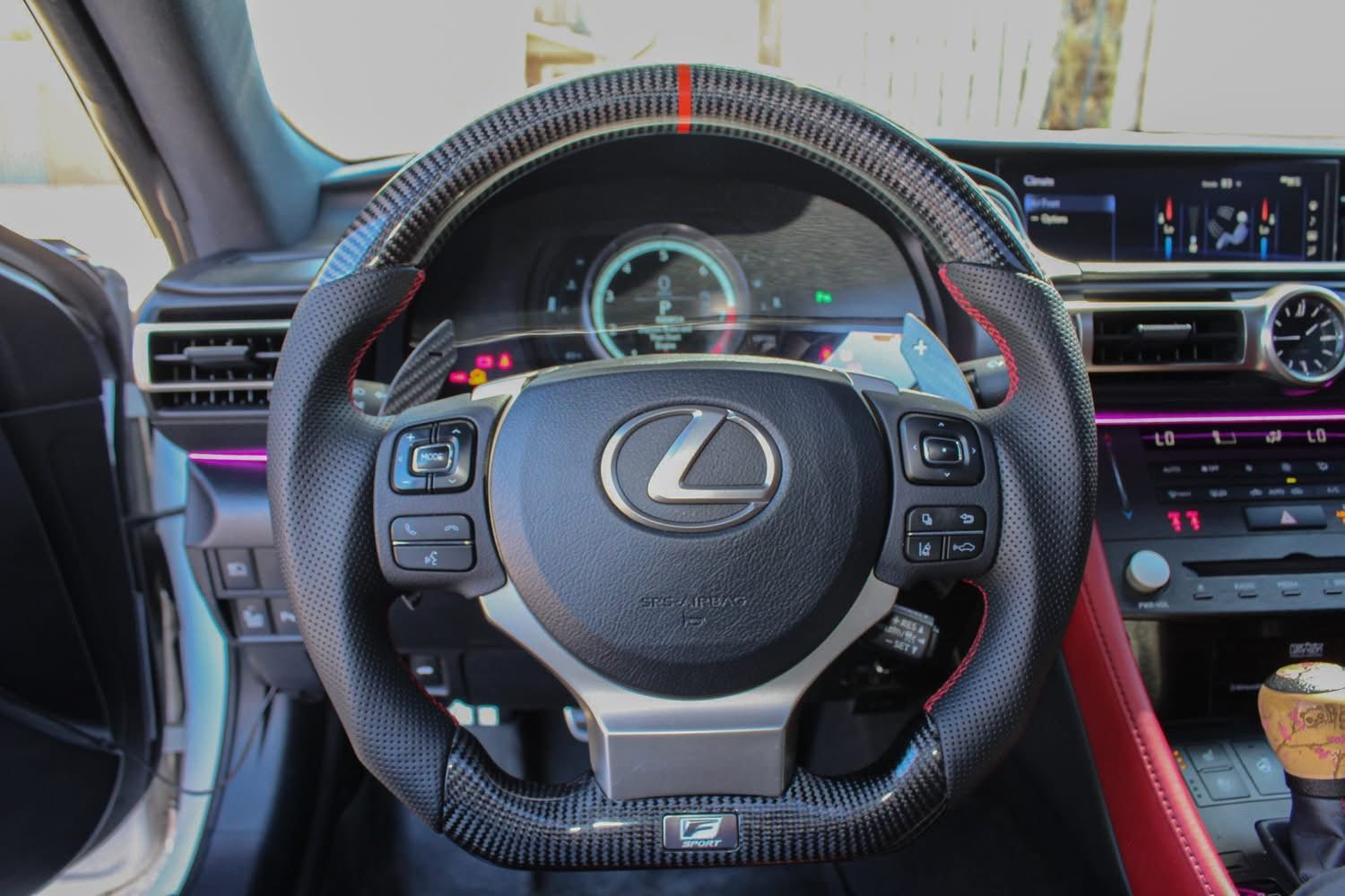 Real installed Lexus carbon fiber steering wheel with red stripe from the RevexaAuto product catalog