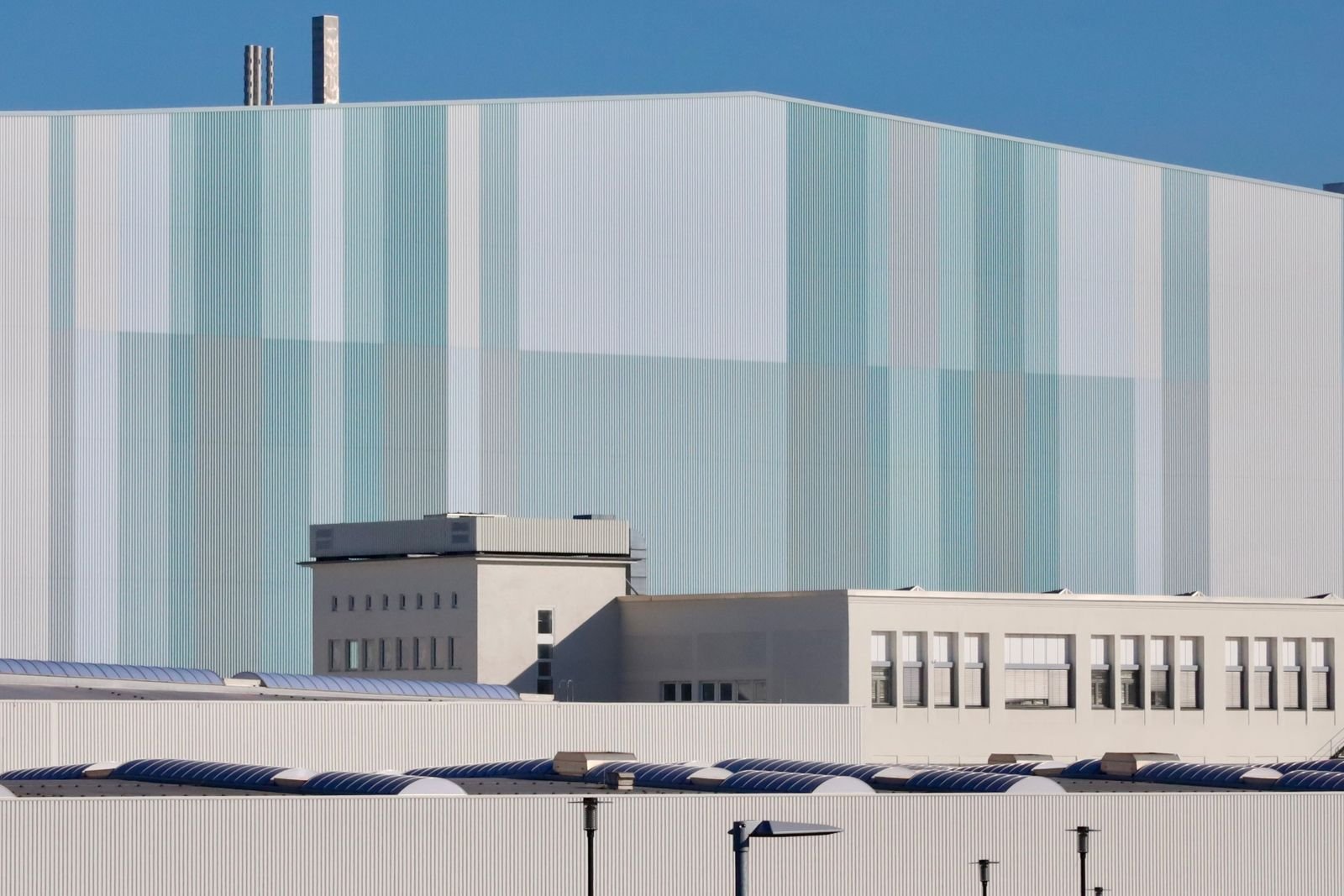 Real industrial facility exterior — illustrative industry photograph