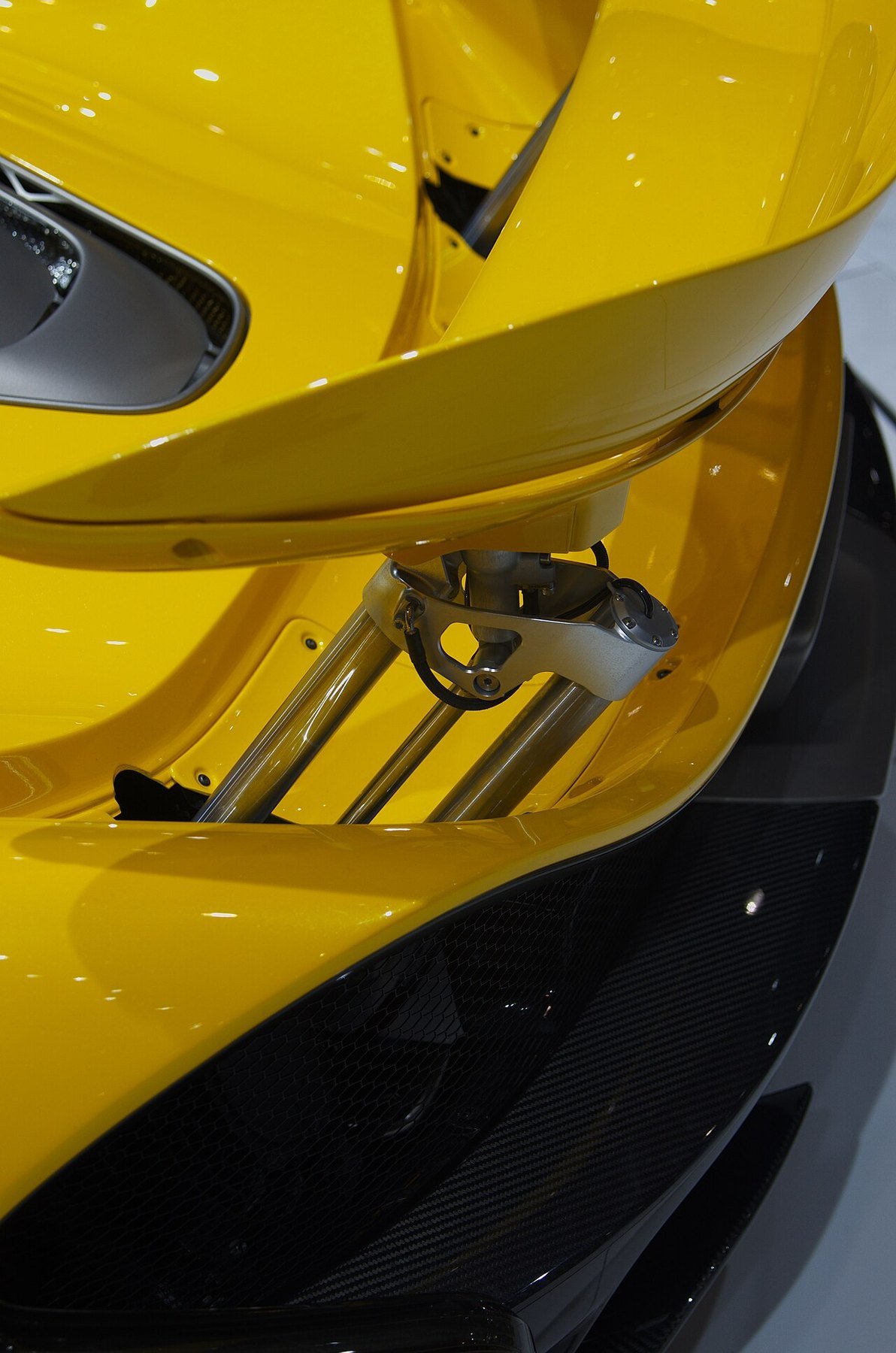 Real close-up photograph of the active rear spoiler on a McLaren P1