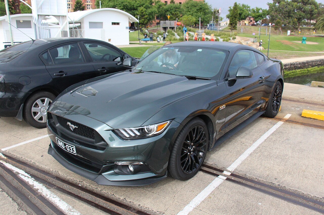 Real photograph of a Ford Mustang GT with its hood and front panel gaps visible
