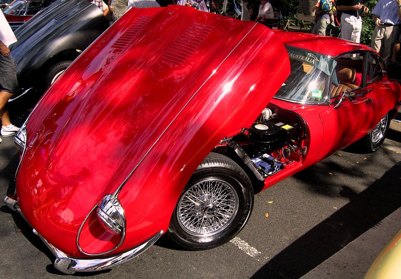 Real photograph of a Jaguar E-Type with the clamshell hood open