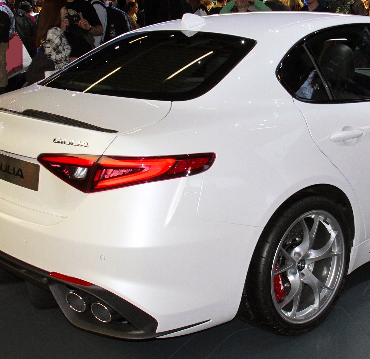 Real close-up photograph of a carbon trunk lip on an Alfa Romeo Giulia Quadrifoglio