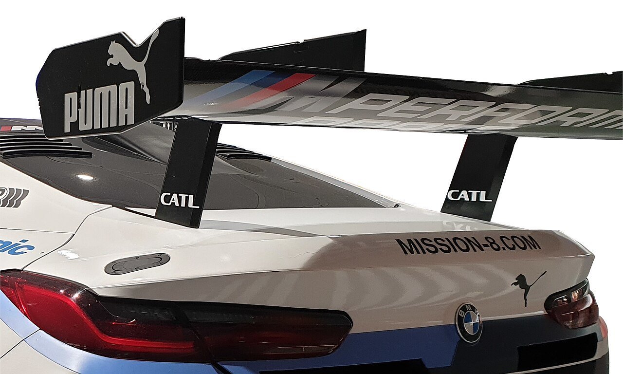 Real close-up photograph of the carbon rear wing on a BMW M8 GTE