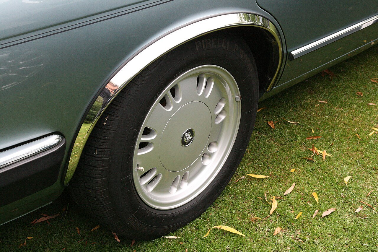 Real photograph of a Jaguar alloy wheel and its center cap
