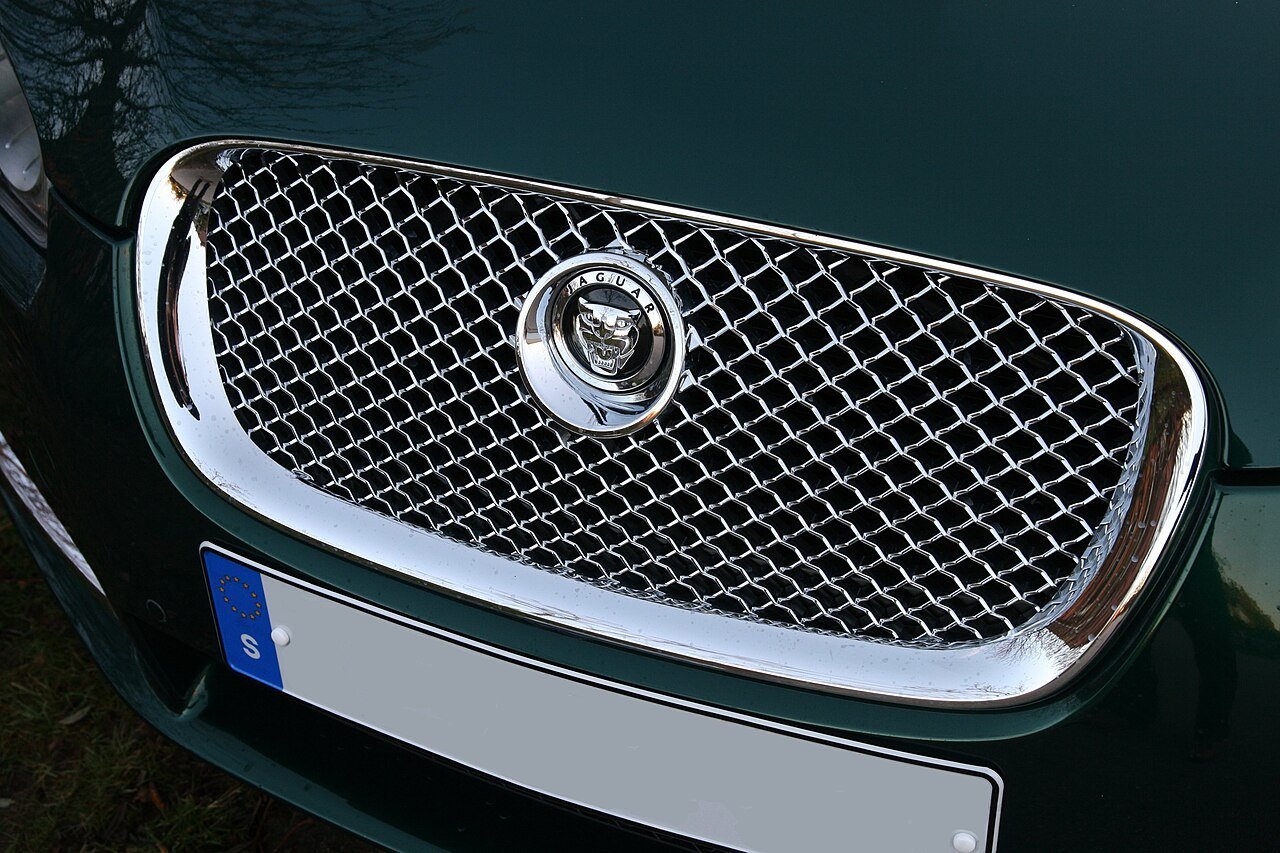 Real close-up photograph of a Jaguar XF grille and badge