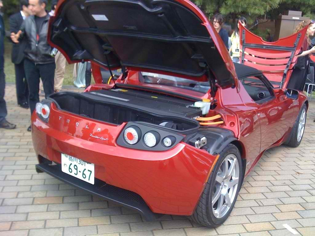Real photograph of a Tesla Roadster with its trunk open