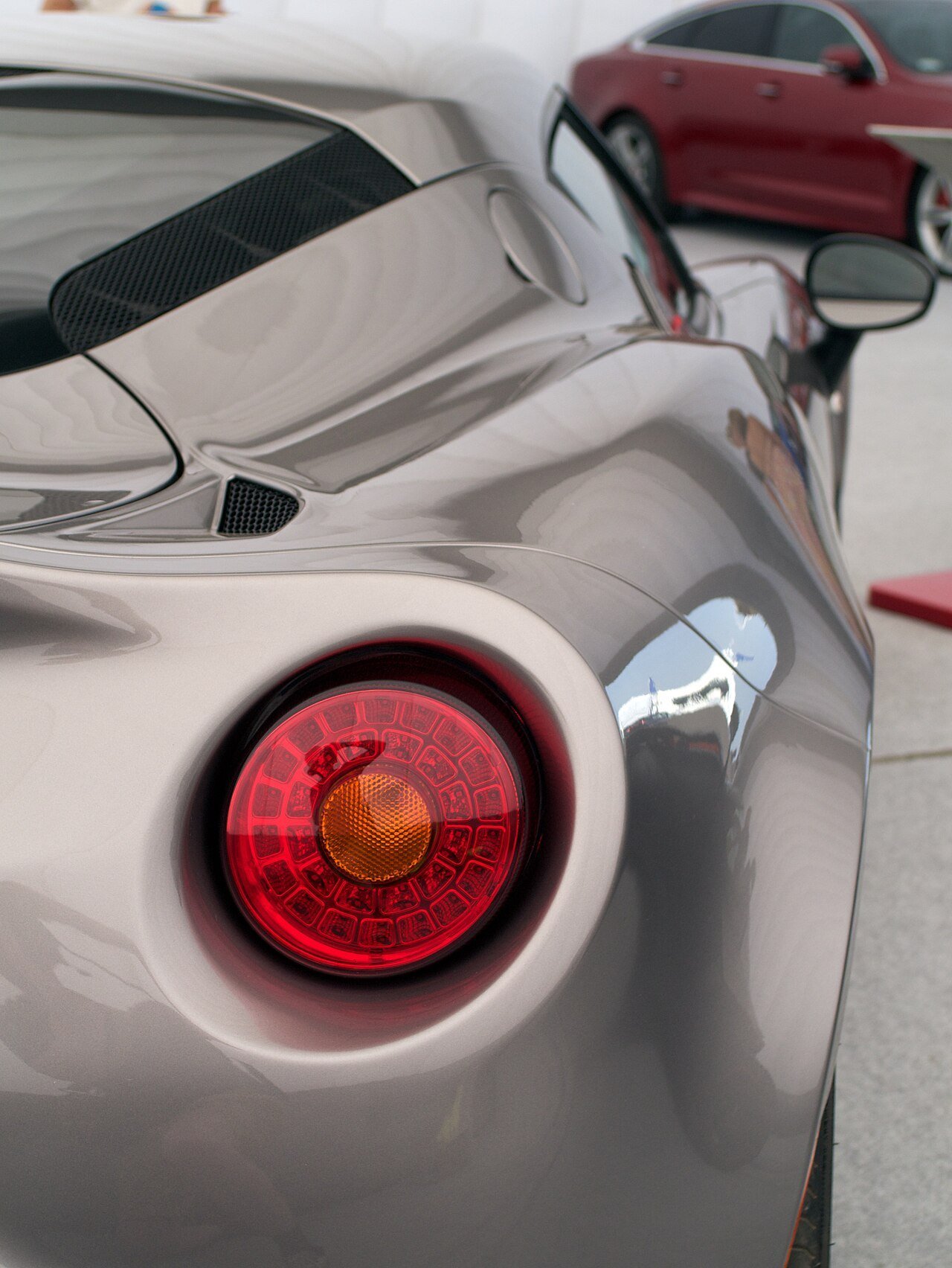 Real close-up photograph of an Alfa Romeo 4C rear lamp