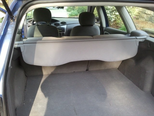 Real photograph of a Ford Focus trunk lid in the open position