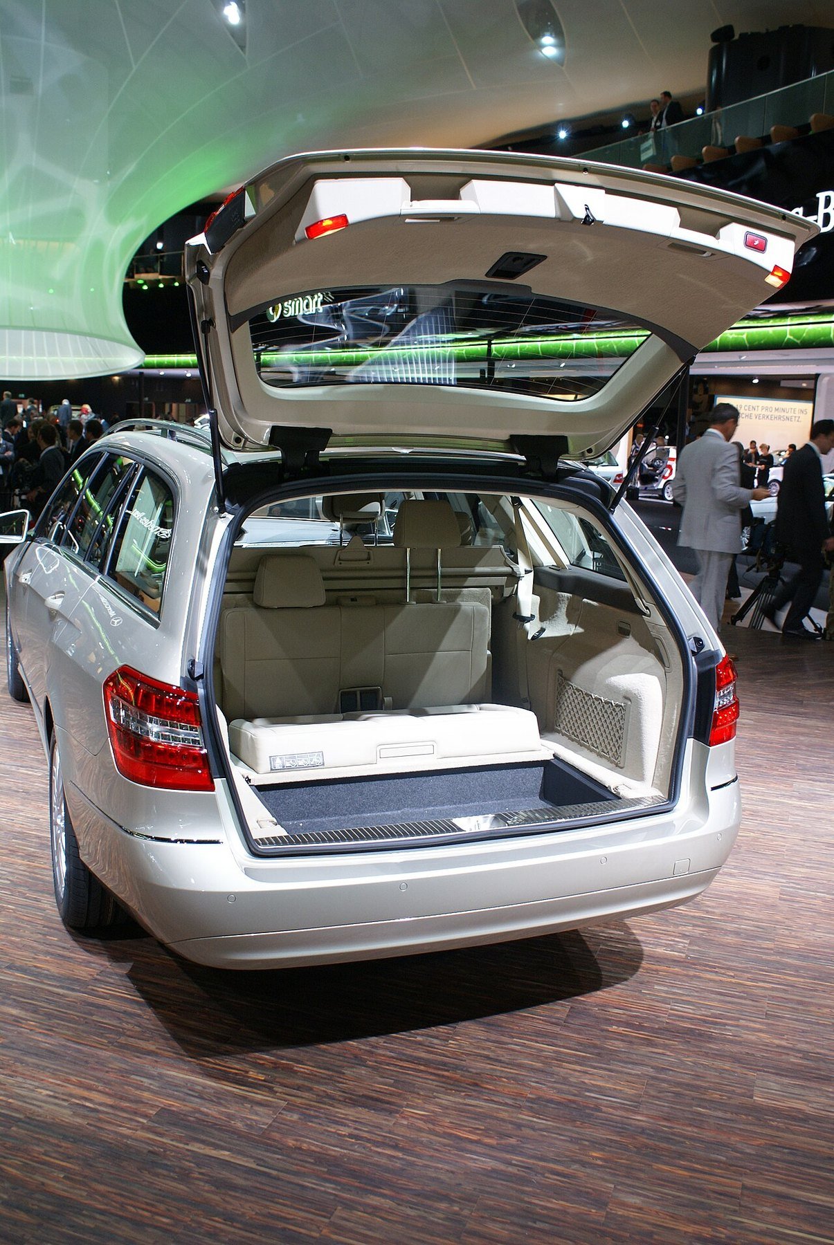 Real photograph of an open Mercedes-Benz cargo trunk at an auto show