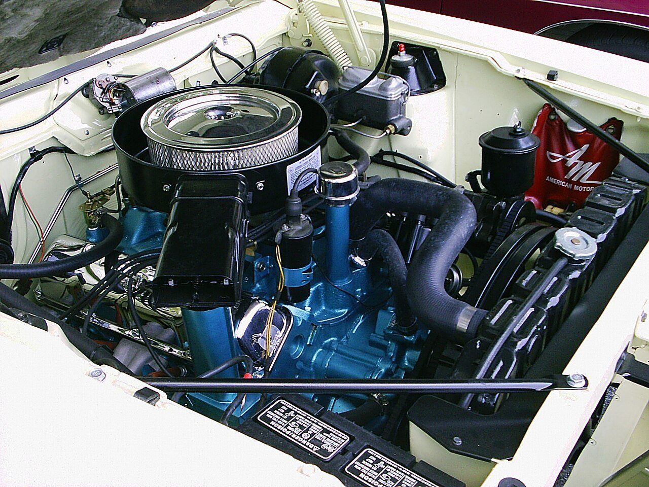 Real photograph of an AMC Javelin engine bay and ram-air hood system