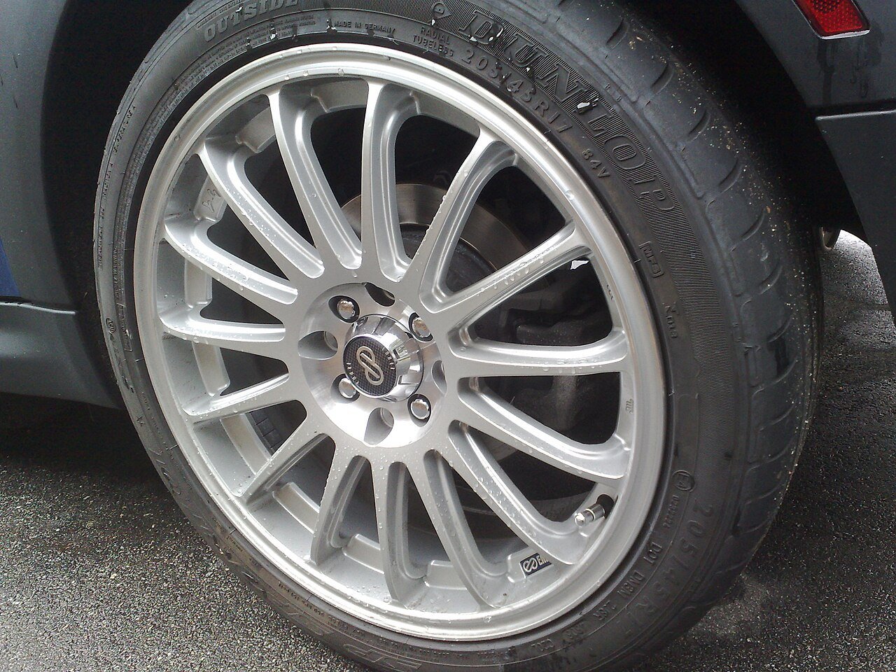 Real close-up photograph of a Mini alloy wheel on a car