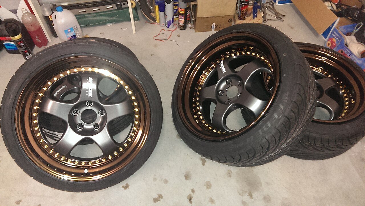 Real photograph of a Work Meister multi-piece alloy wheel